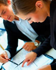 Two business people working together